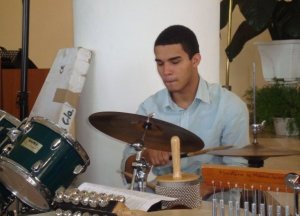 Ernesto Julio playing the drums.